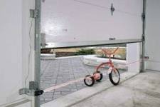 PHOTO-EYE reversal system stopping a garage door closing on a bike