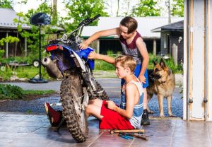 Children with a Motocross in the garage