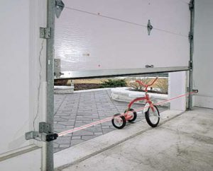 PHOTO-EYE reversal system stopping a garage door closing on a bike